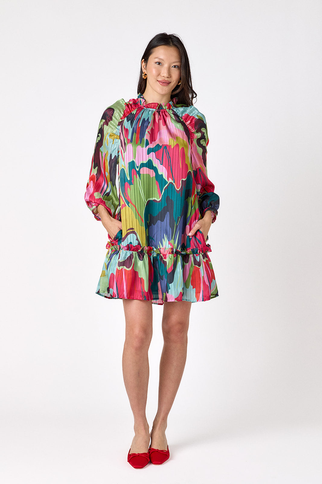 Flynn Dress in Life of the Party featuring puff sleeves and ruffle detailing on model – CROSBY by Mollie Burch