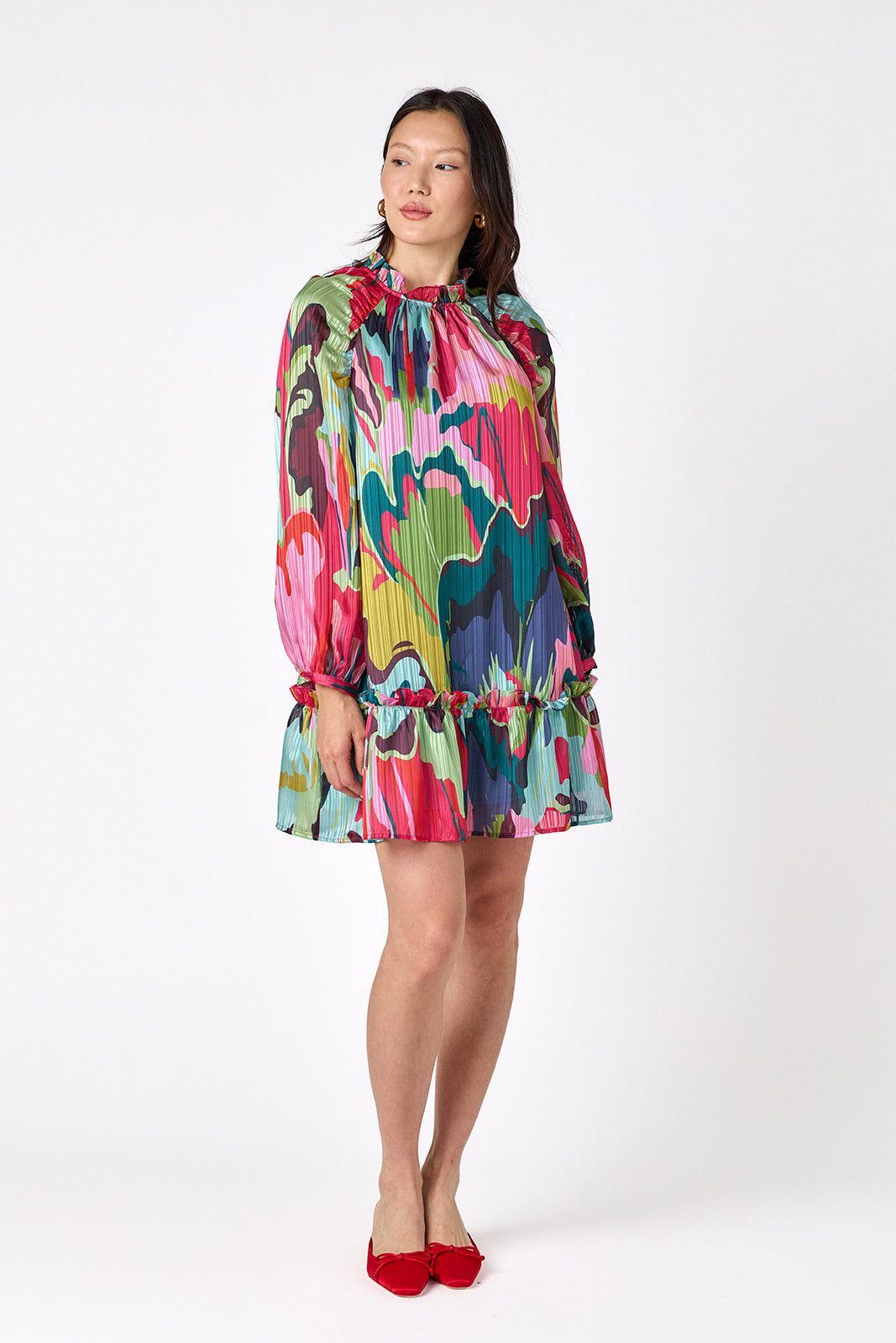 Flynn Dress in Life of the Party featuring puff sleeves and ruffle detailing on model – CROSBY by Mollie Burch