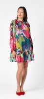Flynn Dress in Life of the Party featuring puff sleeves and ruffle detailing on model – CROSBY by Mollie Burch