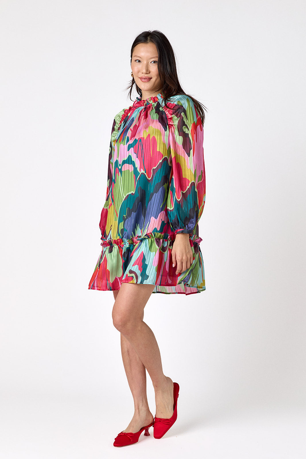 Flynn Dress in Life of the Party featuring puff sleeves and ruffle detailing on model – CROSBY by Mollie Burch