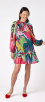 Flynn Dress in Life of the Party featuring puff sleeves and ruffle detailing on model – CROSBY by Mollie Burch