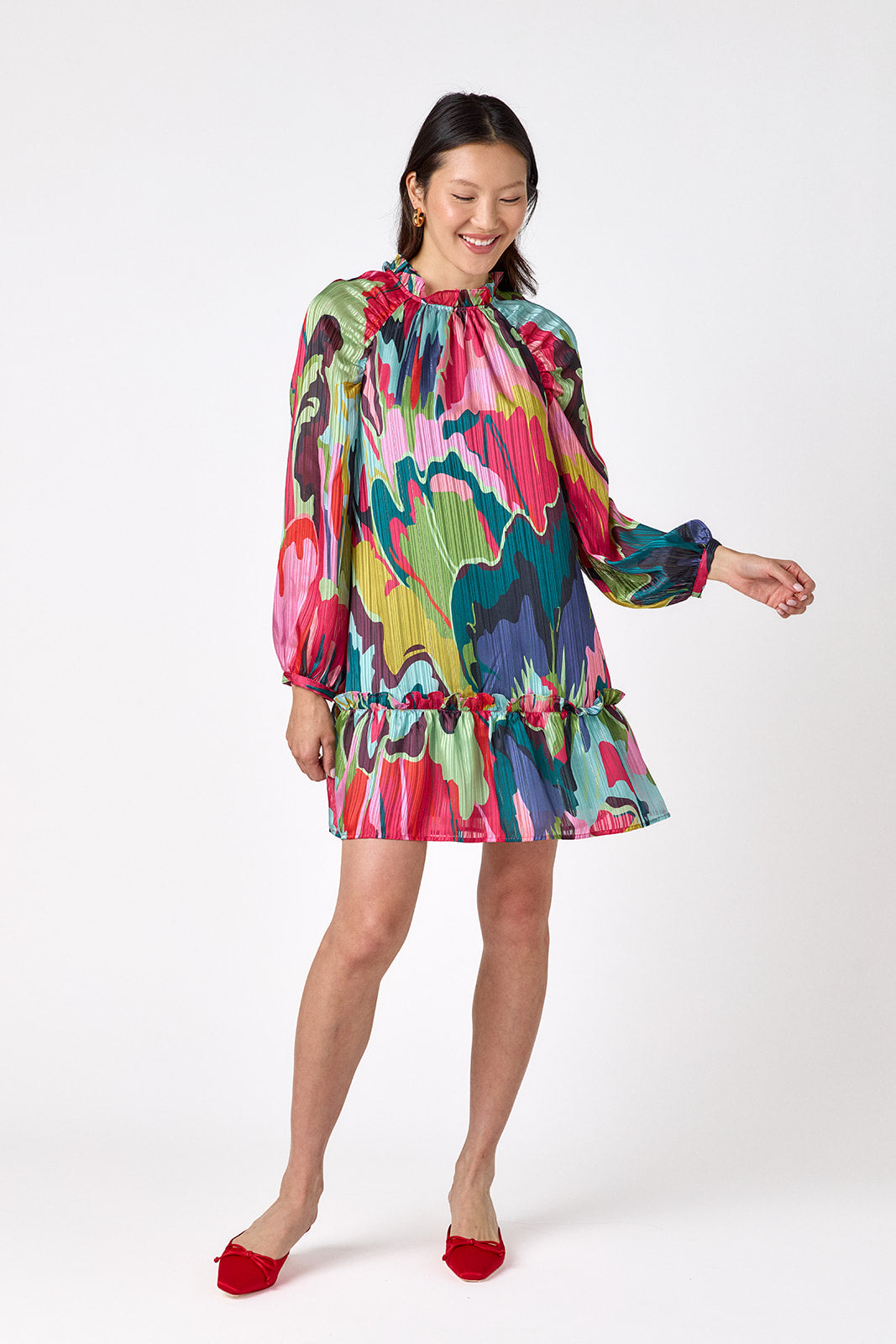 Flynn Dress in Life of the Party featuring puff sleeves and ruffle detailing on model – CROSBY by Mollie Burch