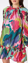 Flynn Dress in Life of the Party featuring puff sleeves and ruffle detailing on model – CROSBY by Mollie Burch