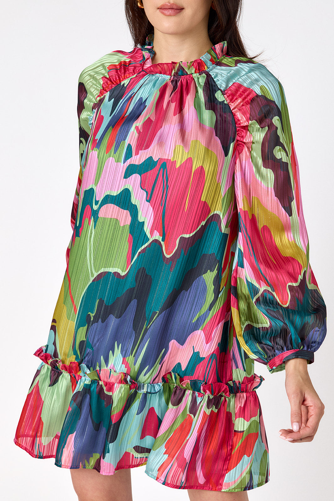 Flynn Dress in Life of the Party featuring puff sleeves and ruffle detailing on model – CROSBY by Mollie Burch