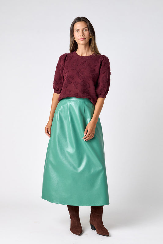 Malachite voluminous faux leather A-line skirt on model – CROSBY by Mollie Burch