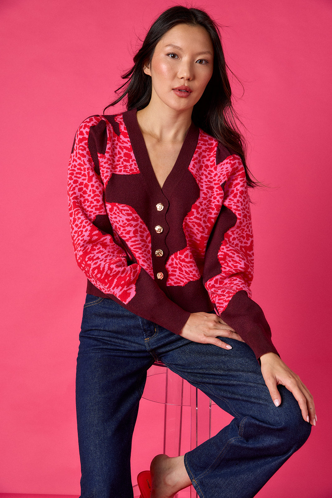 Catwalk Pink v-neck cardigan with scallop detail on model – CROSBY by Mollie Burch