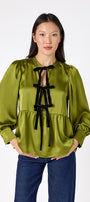 Renny Top featuring festive velvet bow detailing on model – CROSBY by Mollie Burch