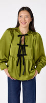 Renny Top featuring festive velvet bow detailing on model – CROSBY by Mollie Burch