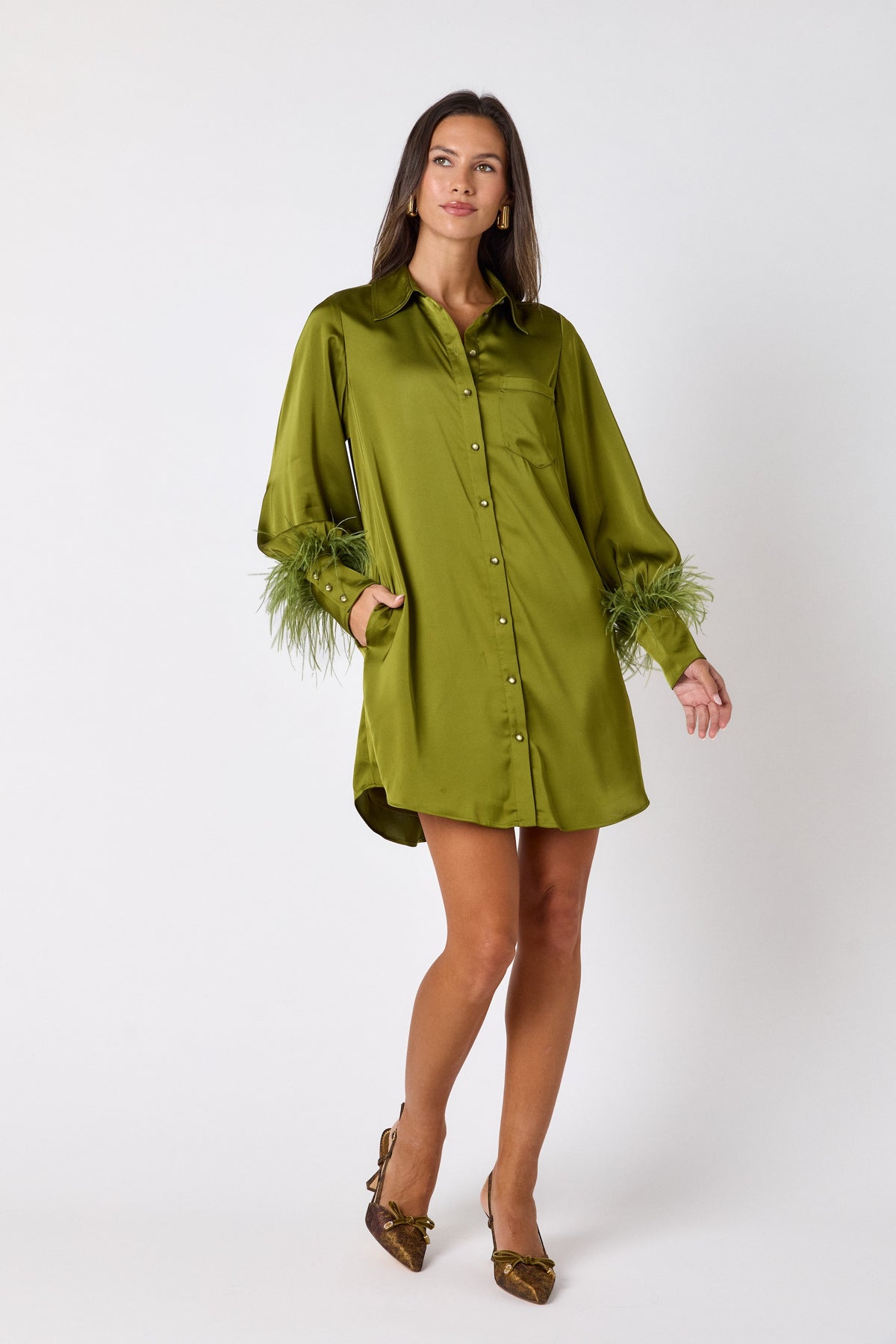 Crawford Dress in Martini featuring ostrich feather cuffs and button-front detailing on model – CROSBY by Mollie Burch