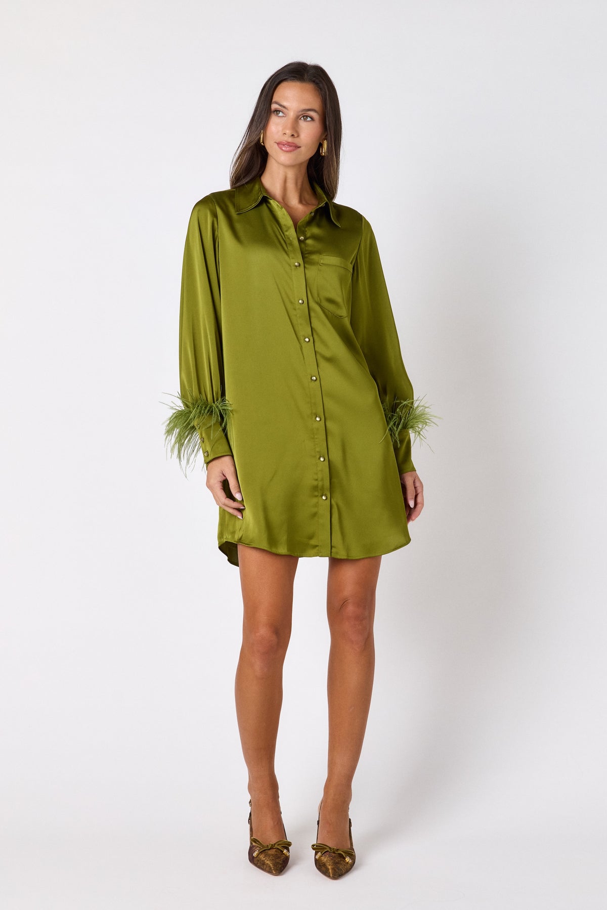 Crawford Dress in Martini featuring ostrich feather cuffs and button-front detailing on model – CROSBY by Mollie Burch