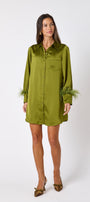 Crawford Dress in Martini featuring ostrich feather cuffs and button-front detailing on model – CROSBY by Mollie Burch