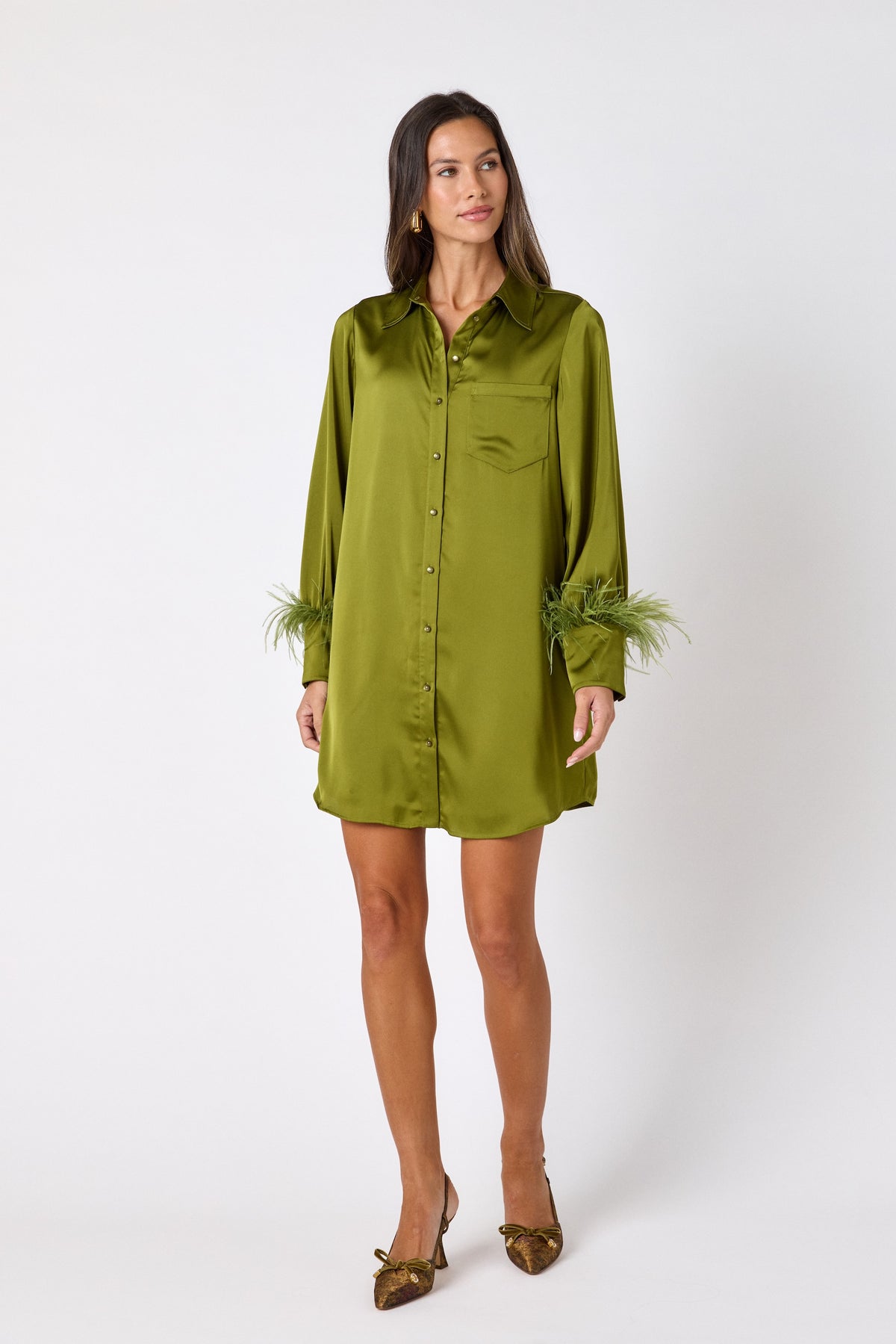 Crawford Dress in Martini featuring ostrich feather cuffs and button-front detailing on model – CROSBY by Mollie Burch