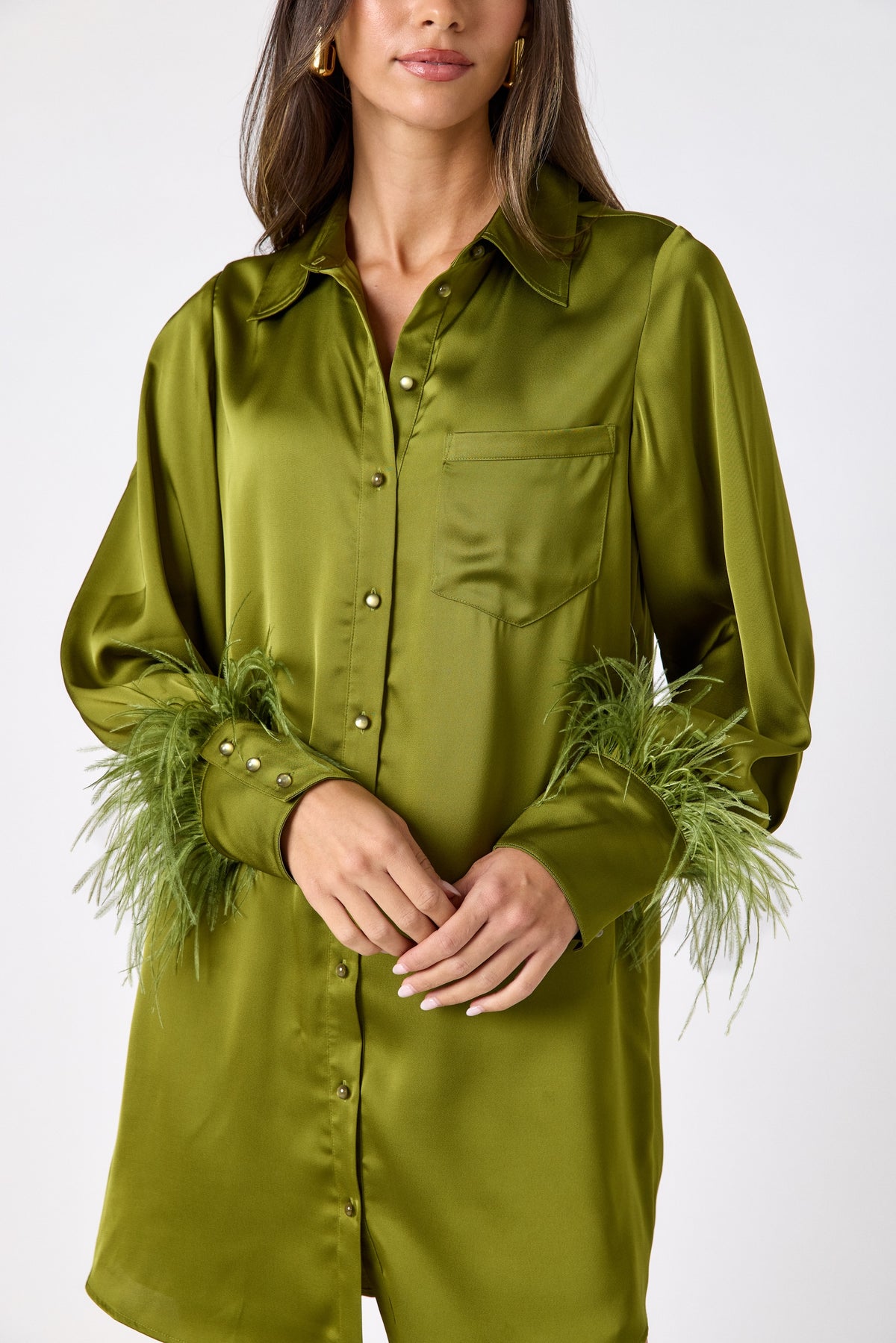 Crawford Dress in Martini featuring ostrich feather cuffs and button-front detailing on model – CROSBY by Mollie Burch