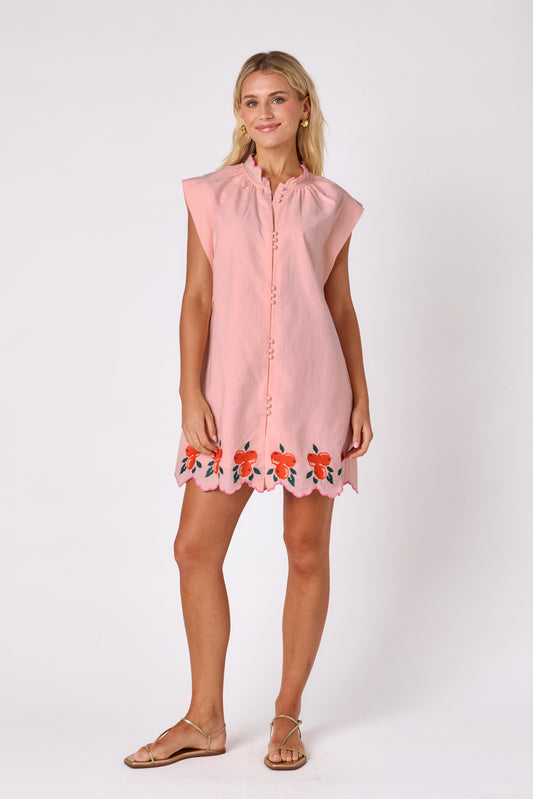Orange Crush button-front mini dress with orange embroidery detail and scallop hem on model — CROSBY by Mollie Burch