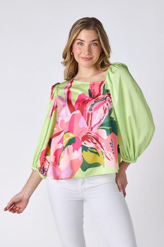 Orchid 3/4 sleeve top with asymmetrical neckline on model — CROSBY by Mollie Burch