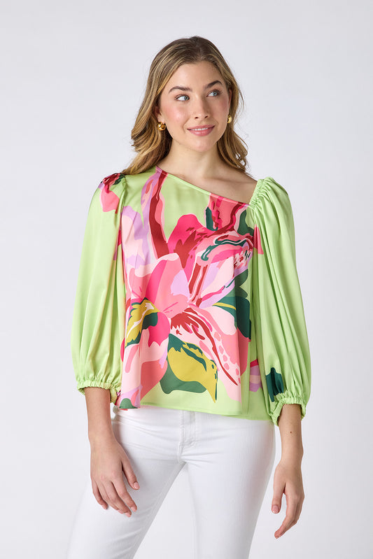 Orchid 3/4 sleeve top with asymmetrical neckline on model — CROSBY by Mollie Burch
