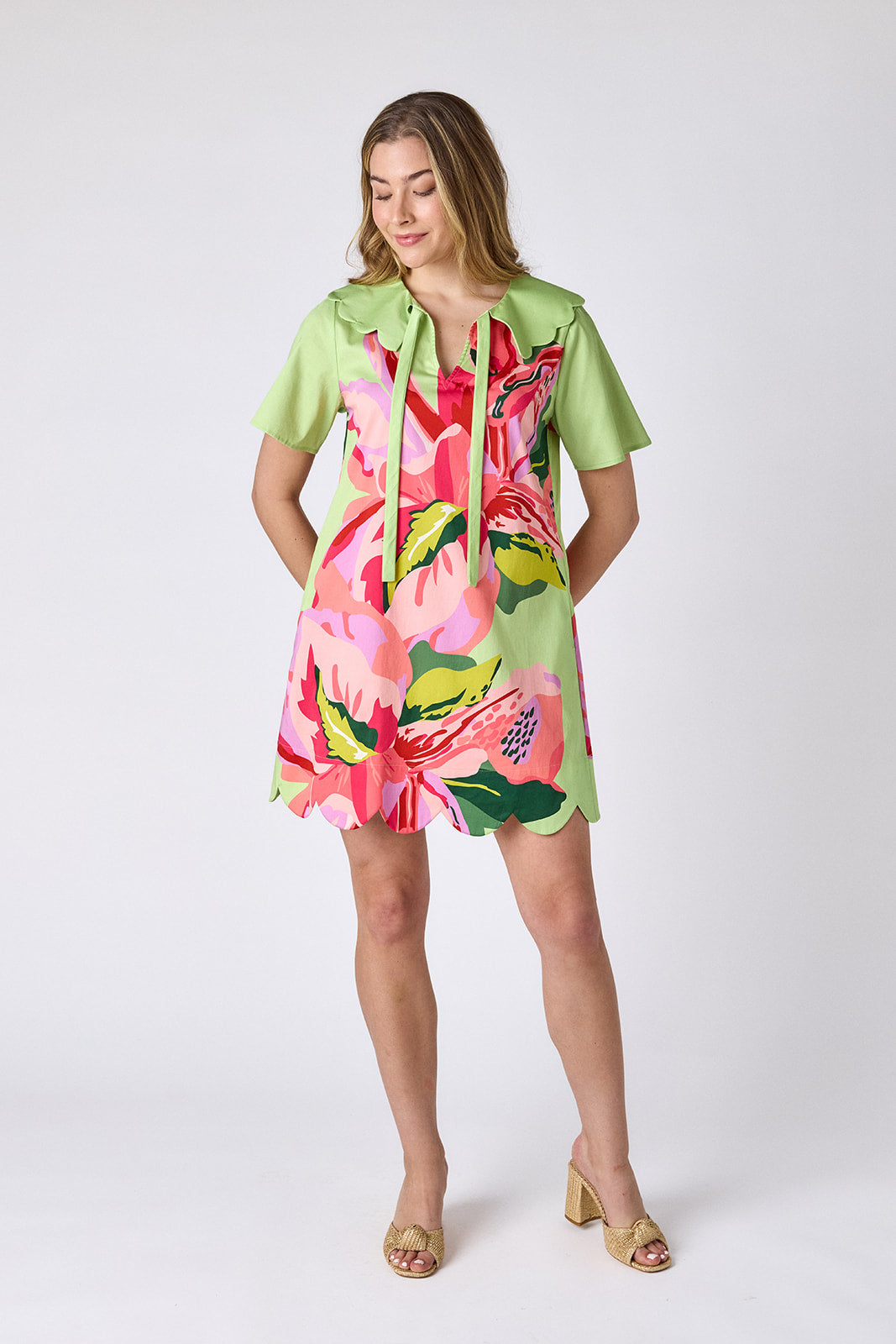 Orchid mini dress with scalloped collar and hem on model — CROSBY by Mollie Burch