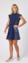 Oxford Navy A-line dress with faux leather detail on model — CROSBY by Mollie Burch