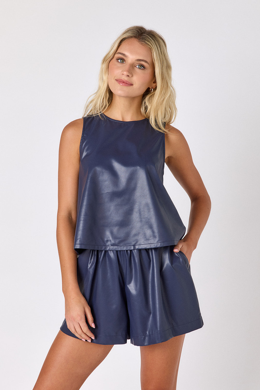 Oxford Navy leather shorts with matching boxy tank on model — CROSBY by Mollie Burch