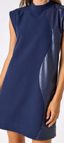 Oxford Navy A-line dress with faux leather detail on model — CROSBY by Mollie Burch
