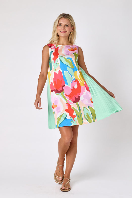 Painted Petals tent style mini dress with side pleat detail on model — CROSBY by Mollie Burch