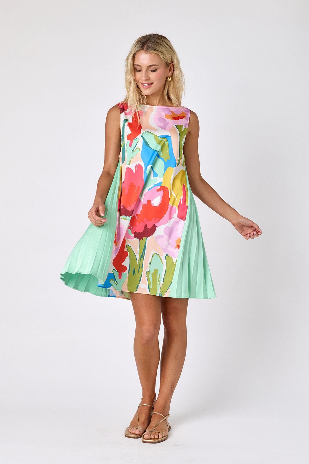 Painted Petals tent style mini dress with side pleat detail on model — CROSBY by Mollie Burch