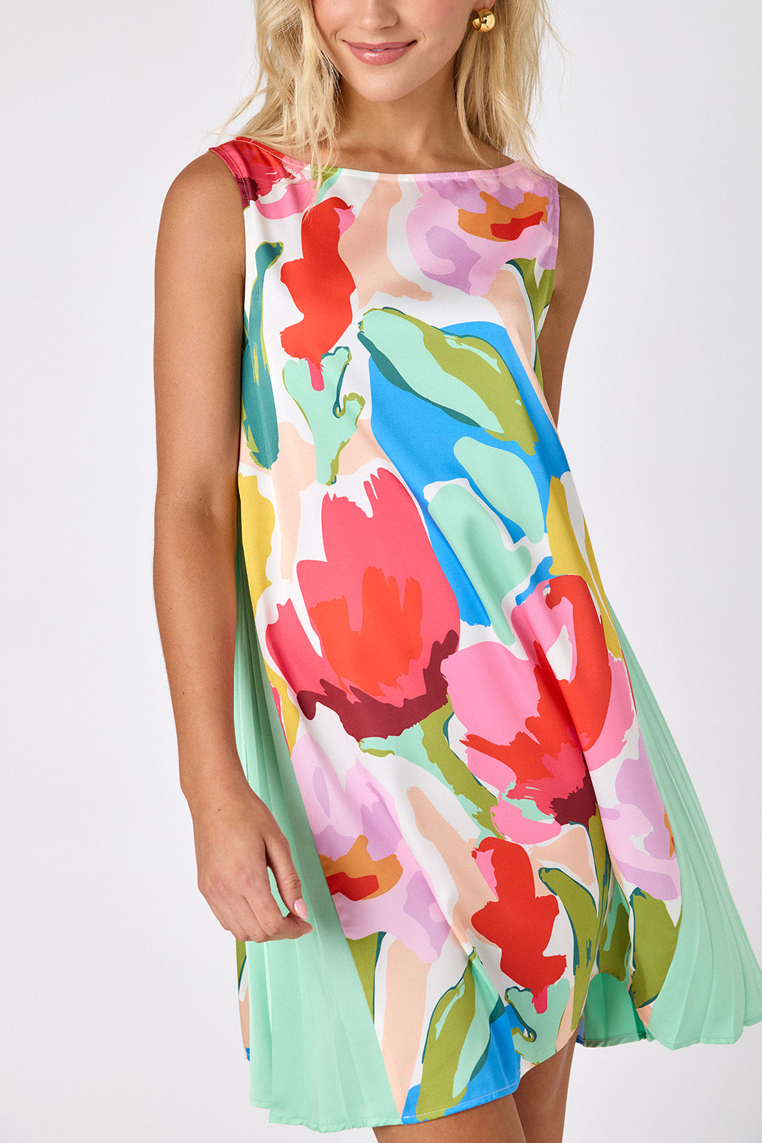 Painted Petals tent style mini dress with side pleat detail on model — CROSBY by Mollie Burch