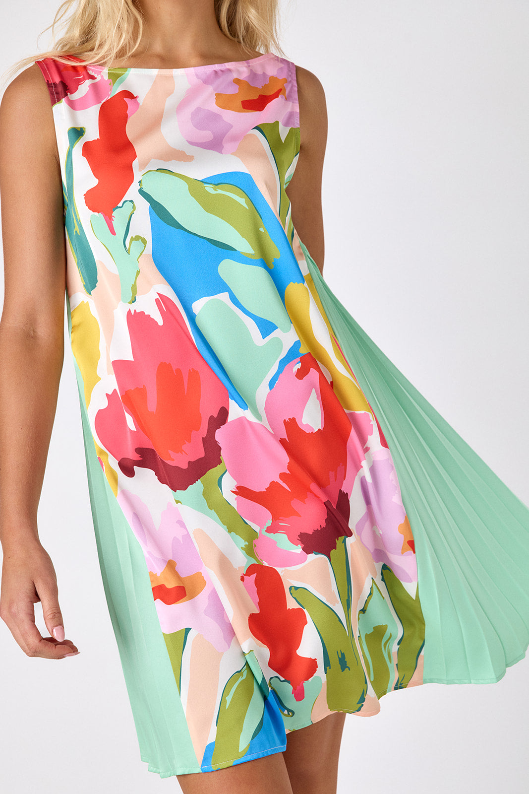 Painted Petals tent style mini dress with side pleat detail on model — CROSBY by Mollie Burch