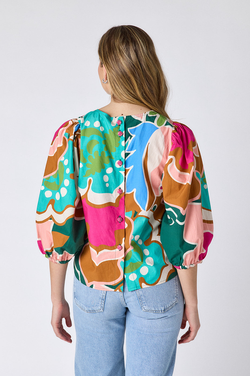 Petal Pop top with balloon sleeve and buttondown back on model — CROSBY by Mollie Burch