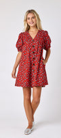 Pheasant v-neck dress with puff sleeves and a swingy silhouette on model — CROSBY by Mollie Burch
