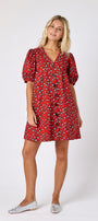 Pheasant v-neck dress with puff sleeves and a swingy silhouette on model — CROSBY by Mollie Burch