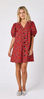 Pheasant v-neck dress with puff sleeves and a swingy silhouette on model — CROSBY by Mollie Burch