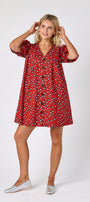 Pheasant v-neck dress with puff sleeves and a swingy silhouette on model — CROSBY by Mollie Burch