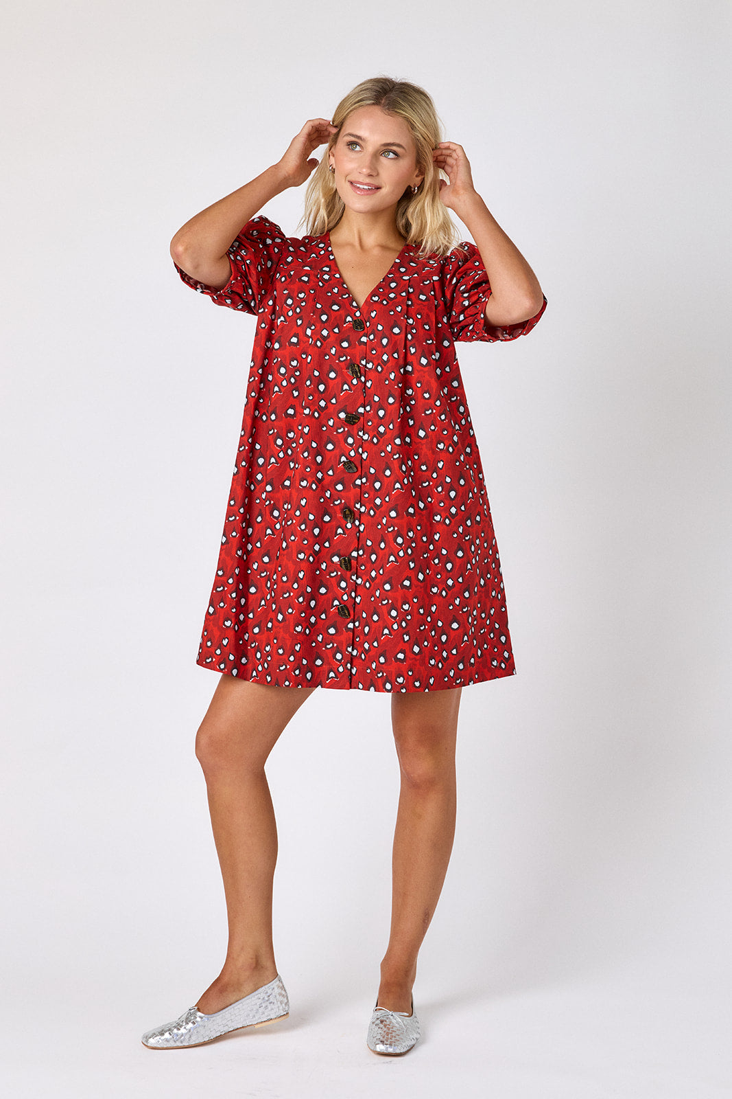 Pheasant v-neck dress with puff sleeves and a swingy silhouette on model — CROSBY by Mollie Burch