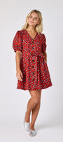 Pheasant v-neck dress with puff sleeves and a swingy silhouette on model — CROSBY by Mollie Burch