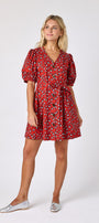 Pheasant v-neck dress with puff sleeves and a swingy silhouette on model — CROSBY by Mollie Burch