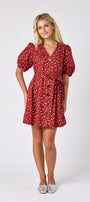 Pheasant v-neck dress with puff sleeves and a swingy silhouette on model — CROSBY by Mollie Burch