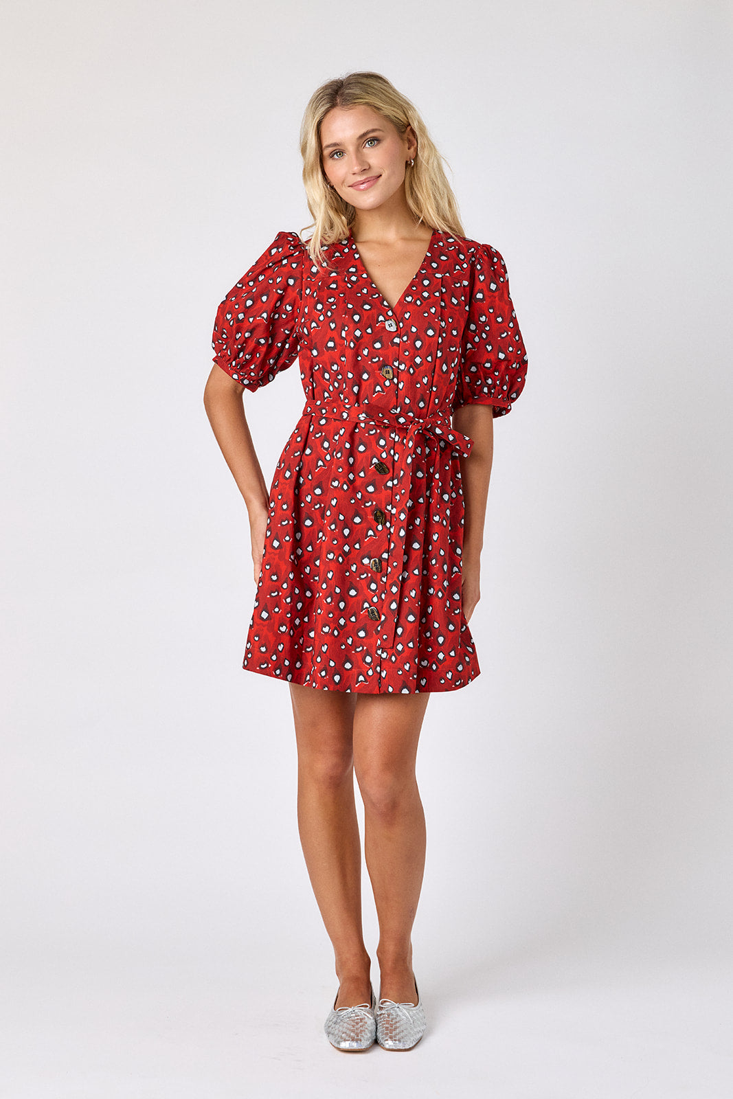 Pheasant v-neck dress with puff sleeves and a swingy silhouette on model — CROSBY by Mollie Burch