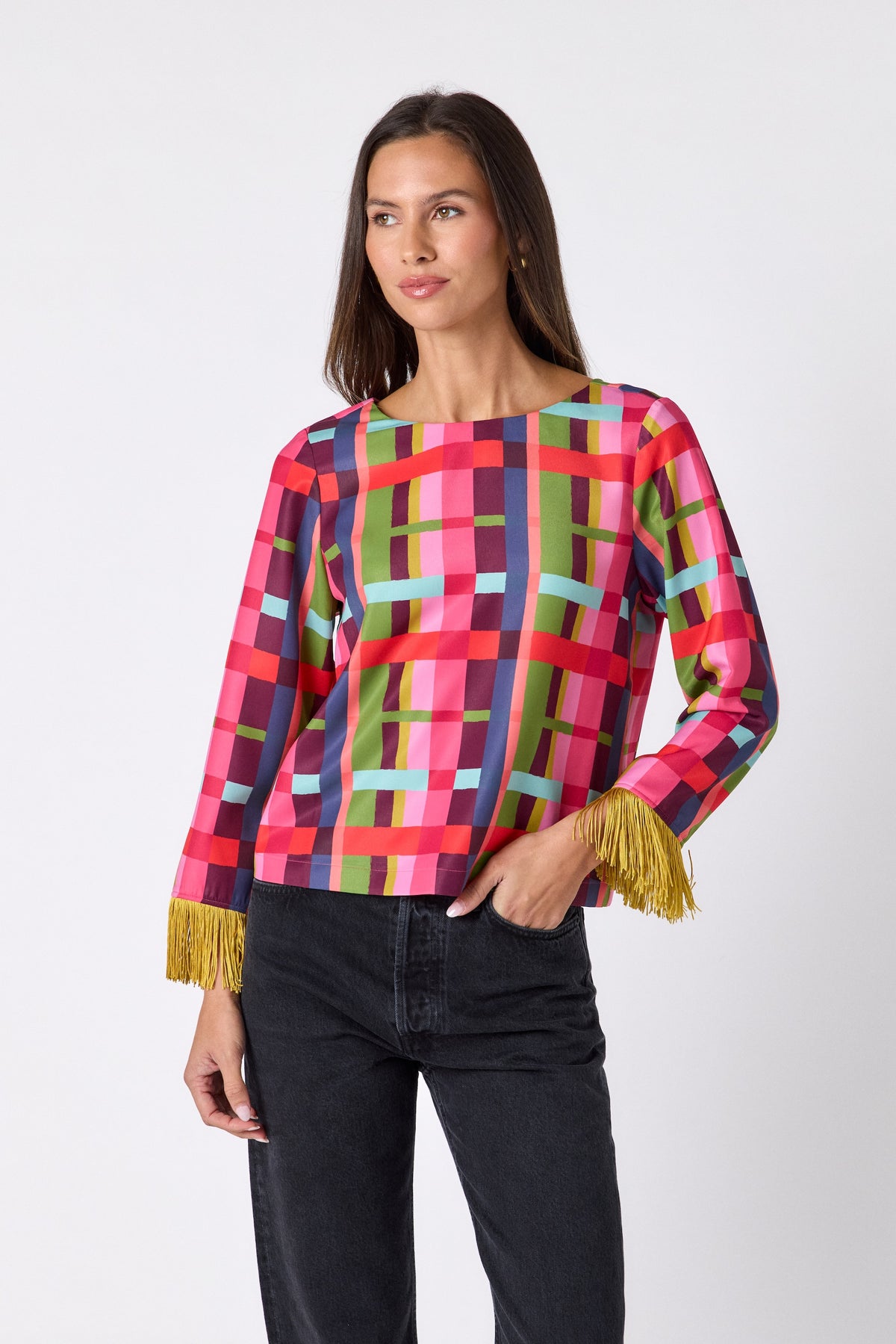 Maya Top in Plaid Parade featuring contrast fringe sleeve cuffs and back neck tie detailing on model – CROSBY by Mollie Burch