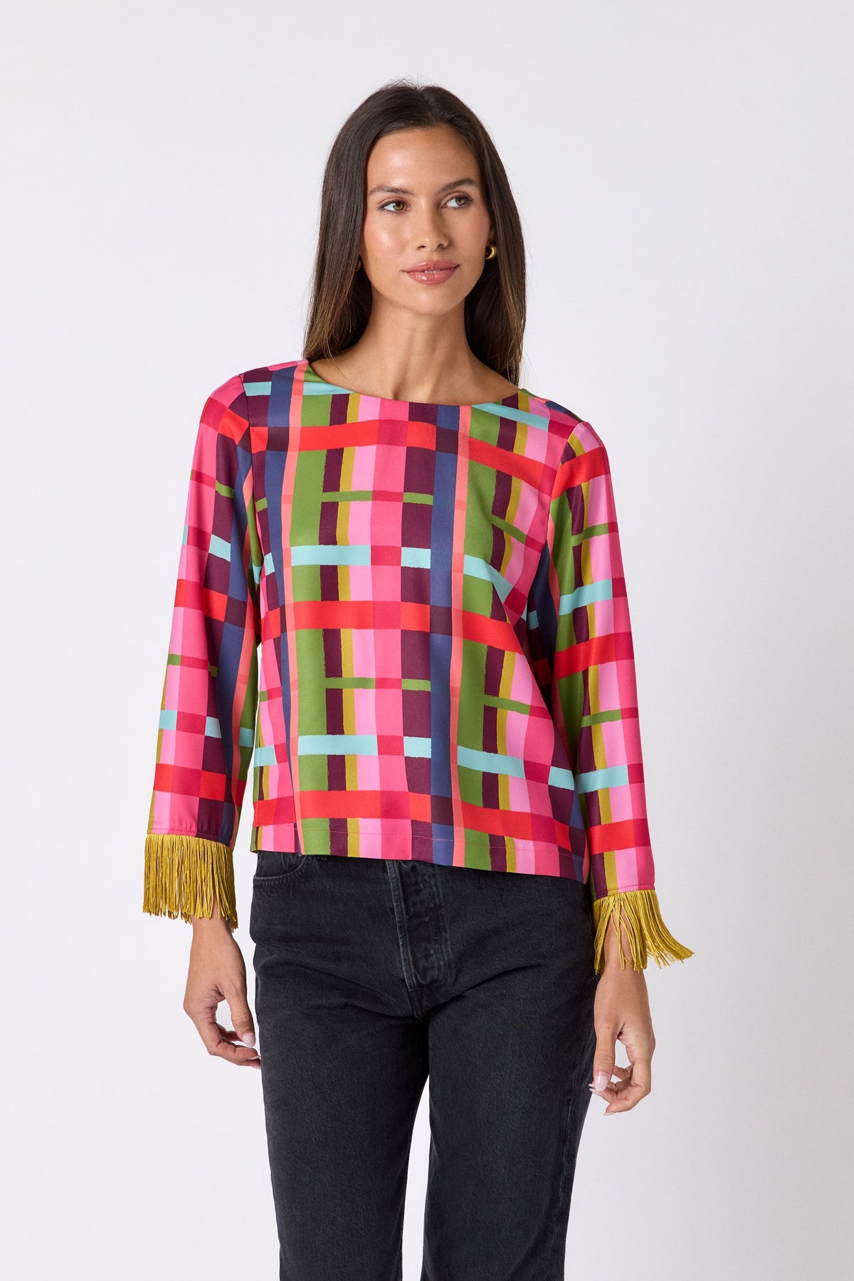 Maya Top in Plaid Parade featuring contrast fringe sleeve cuffs and back neck tie detailing on model – CROSBY by Mollie Burch