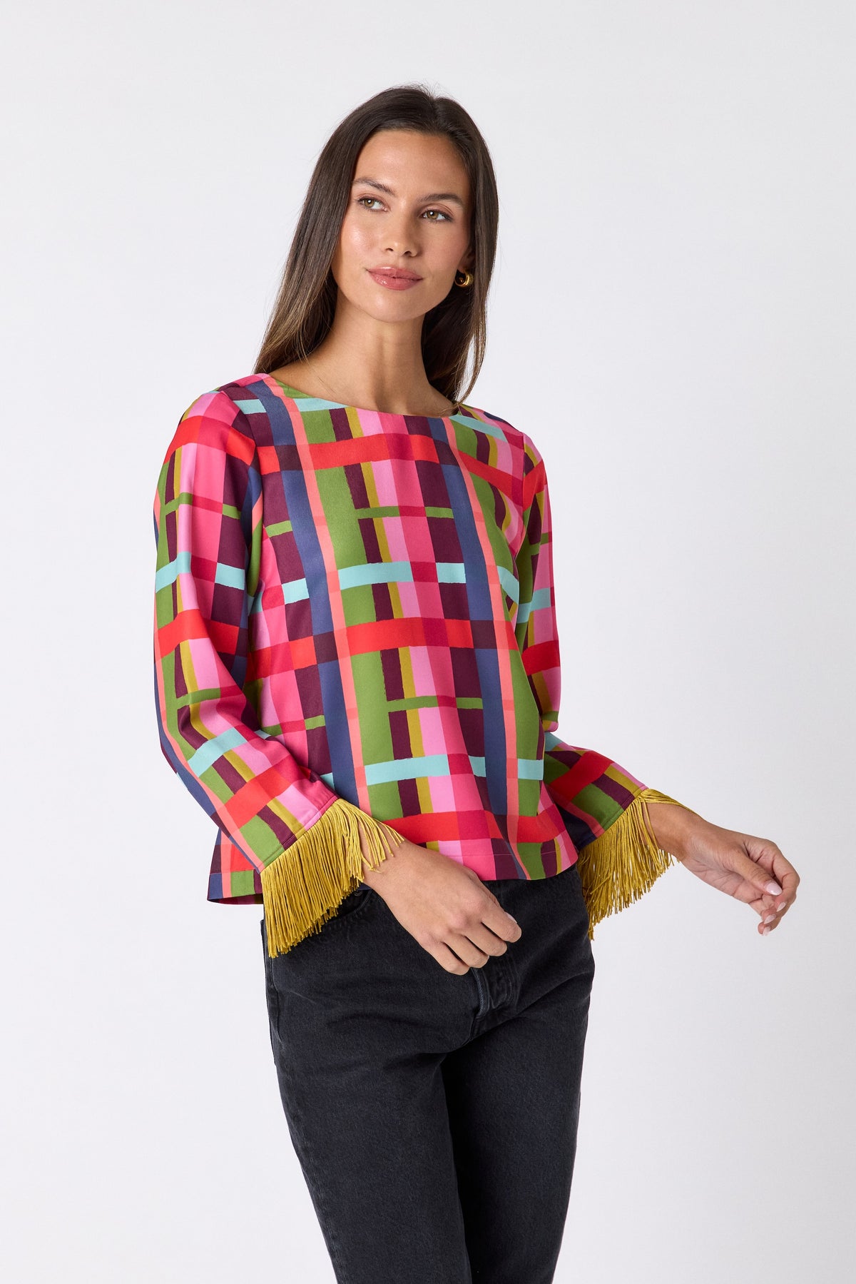 Maya Top in Plaid Parade featuring contrast fringe sleeve cuffs and back neck tie detailing on model – CROSBY by Mollie Burch