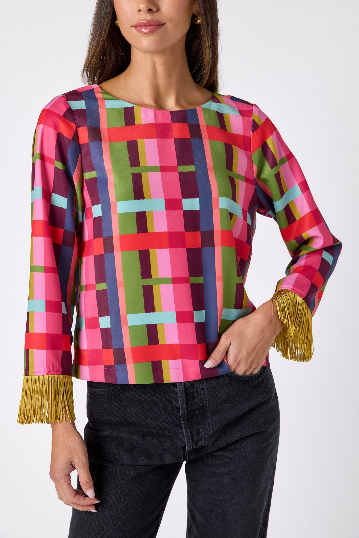 Maya Top in Plaid Parade featuring contrast fringe sleeve cuffs and back neck tie detailing on model – CROSBY by Mollie Burch