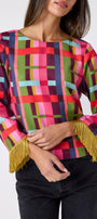 Maya Top in Plaid Parade featuring contrast fringe sleeve cuffs and back neck tie detailing on model – CROSBY by Mollie Burch