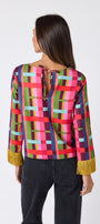 Maya Top in Plaid Parade featuring contrast fringe sleeve cuffs and back neck tie detailing on model – CROSBY by Mollie Burch