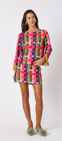 Maya Top in Plaid Parade featuring contrast fringe sleeve cuffs and back neck tie detailing on model – CROSBY by Mollie Burch