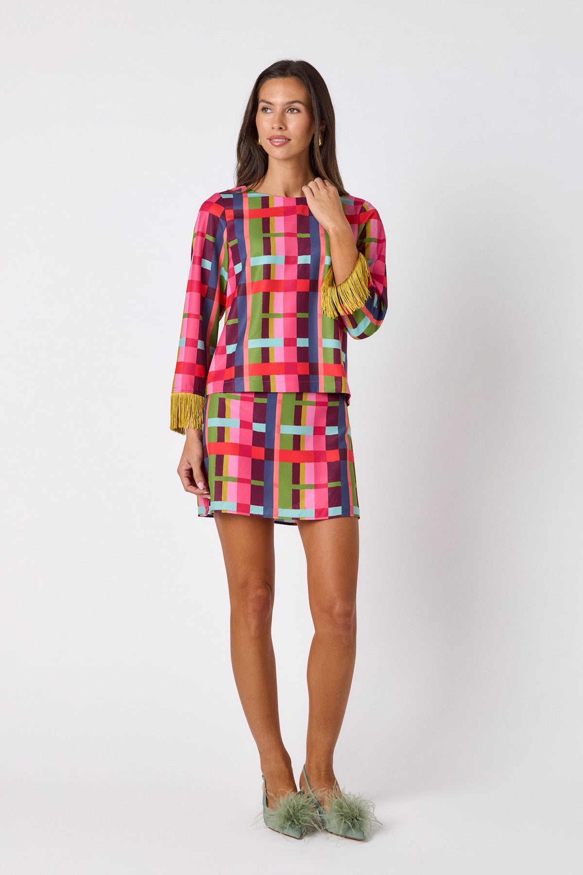 Maya Top in Plaid Parade featuring contrast fringe sleeve cuffs and back neck tie detailing on model – CROSBY by Mollie Burch