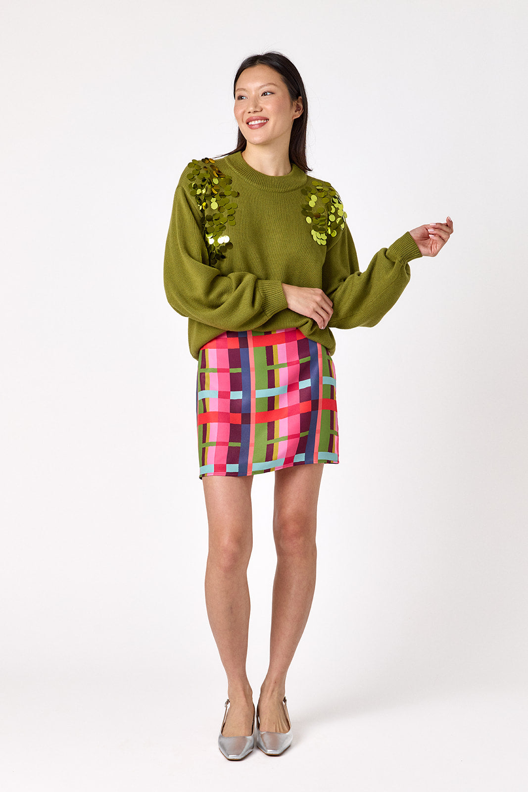  Penny Mini Skirt in Plaid Parade featuring a colorful plaid print on model – CROSBY by Mollie Burch