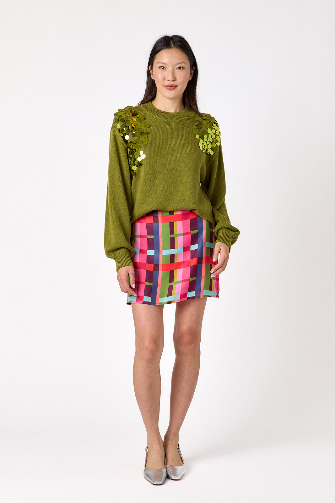  Penny Mini Skirt in Plaid Parade featuring a colorful plaid print on model – CROSBY by Mollie Burch