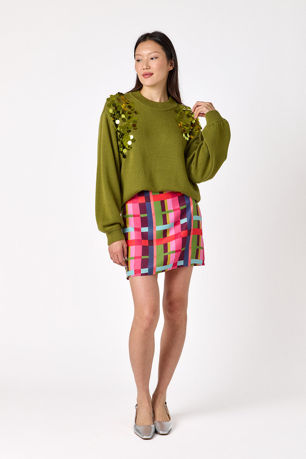 Penny Mini Skirt in Plaid Parade featuring a colorful plaid print on model – CROSBY by Mollie Burch