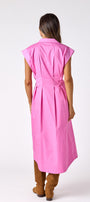 Poppy Pink collared button down dress with waist emphasis on model — CROSBY by Mollie Burch